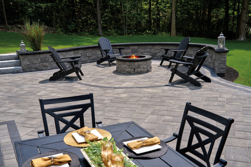 Outdoor patio with fire pit and Adirondack chairs